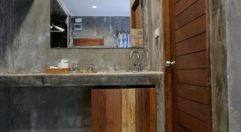 a bathroom with a sink and a toilet, Le Pes Villas (SHA Extra Plus) in Nakhon Si Thammarat