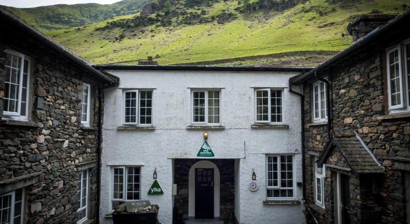 a large building with a clock on the side of it, YHA Helvellyn in Glenridding