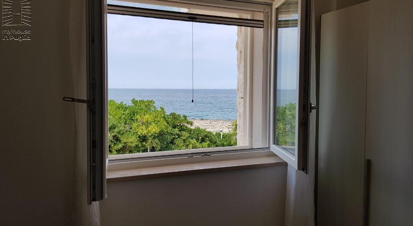 a window with a view of the ocean, Case Vacanza Marzano in Monopoli