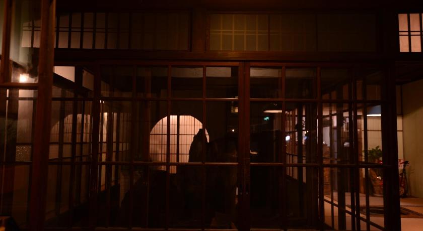 a dark room with a large metal door, TAKETA Station Hostel cue in Kokonoe