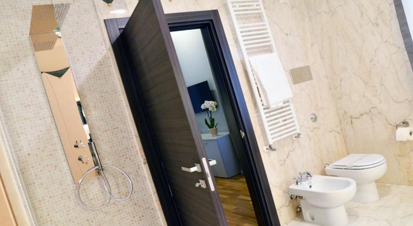a bathroom with a toilet and a shower stall, Borea Luxury B&B in Pescara