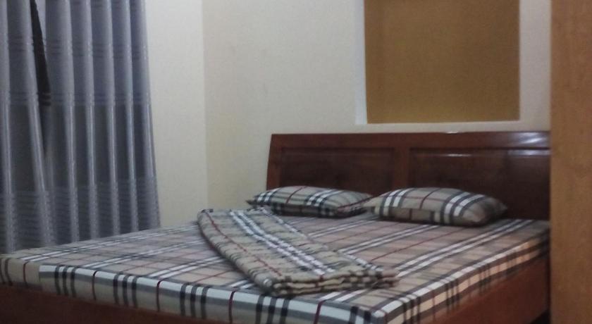 a bedroom with a bed and a dresser, Motel 529 in Vung Tau