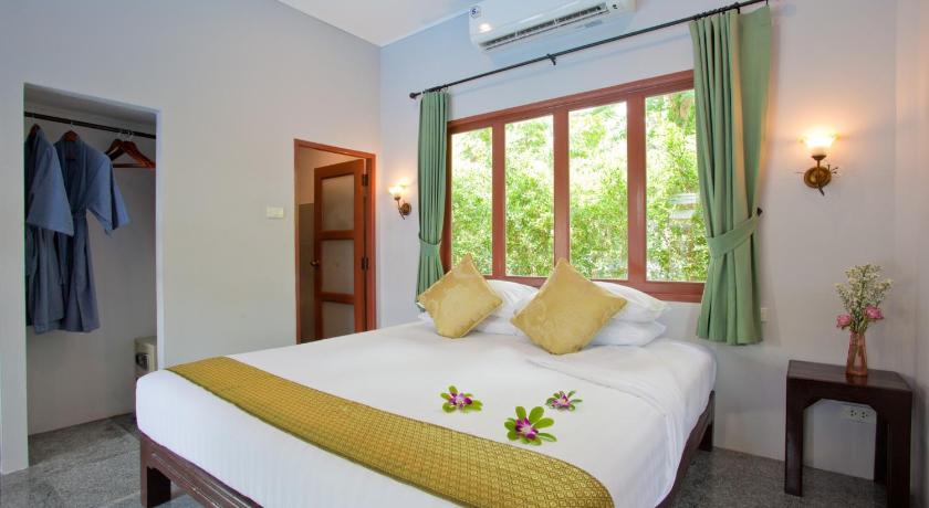a bedroom with a large bed and a large window, Ardea Resort Pool Villa in Amphawa (Samut Songkhram)