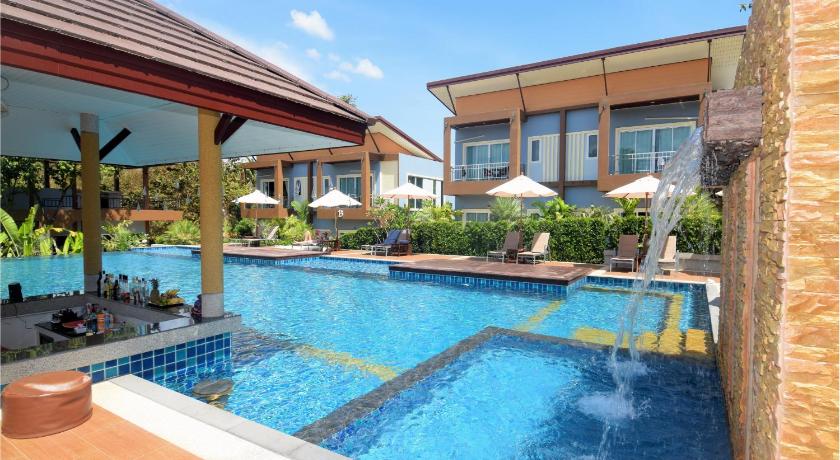 a swimming pool with a pool table and chairs, Phutara Lanta Resort (SHA Plus+) in Koh Lanta
