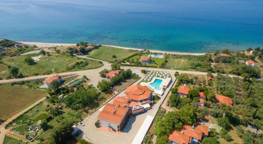 a large building with a view of the ocean, Ismaros Hotel in Platanitis Maronia