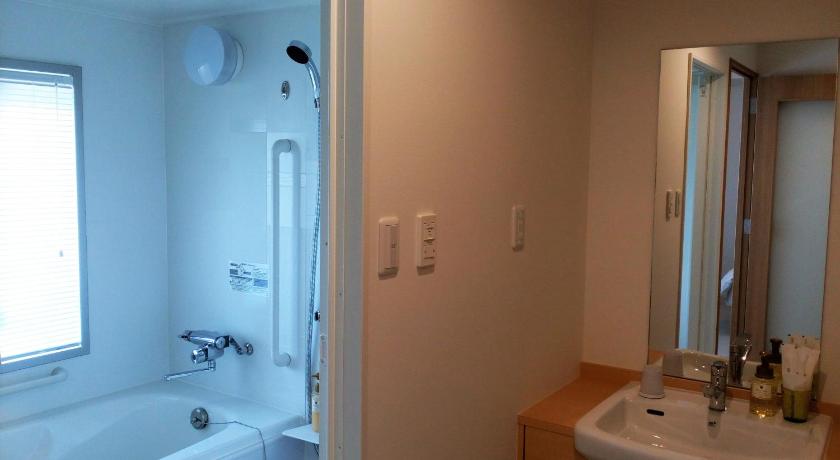 a bathroom with a sink, toilet and bathtub, Hotel Nishimura in Gotemba