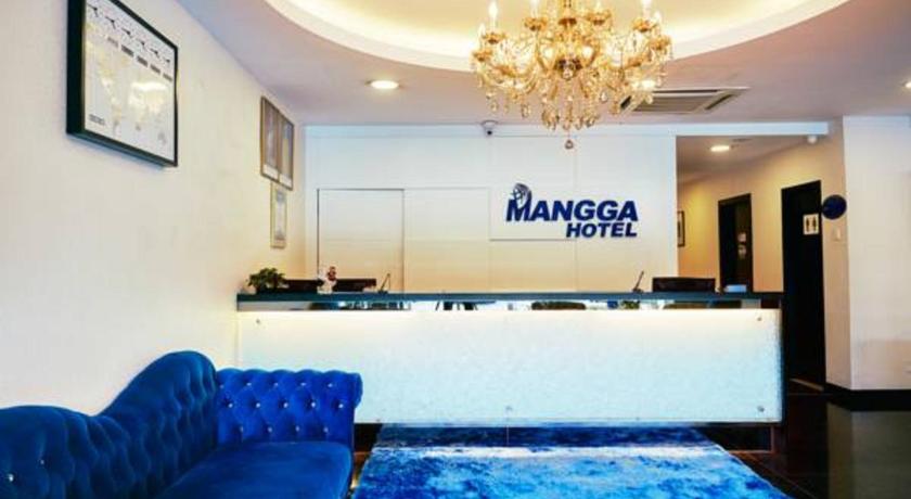 a living room filled with furniture and a blue wall, Mangga Hotel in Kuala Lumpur