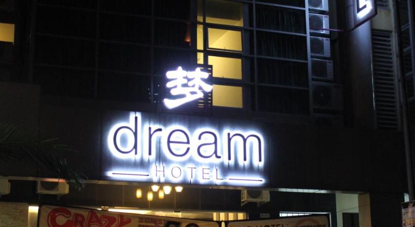 a car parked in front of a tall building, Dream Hotel in Klang