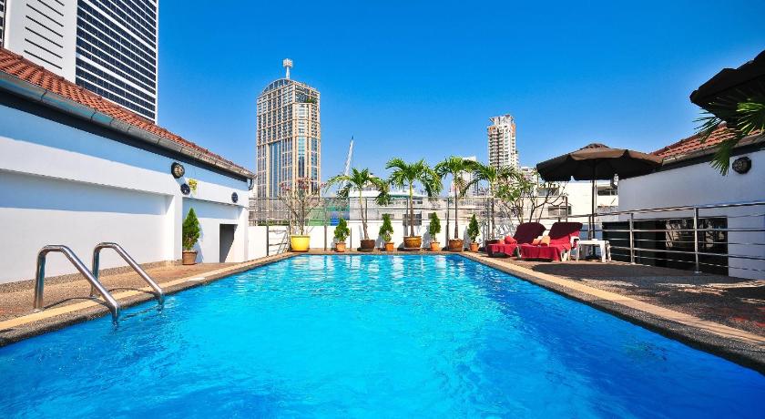 a swimming pool with a pool table in front of it, Admiral Suites Bangkok (SHA Extra Plus) in Bangkok