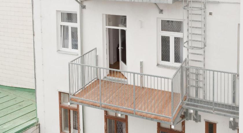 a white and black building with a white door, Vienna Stay Apartments Pezzl 1170 in Vienna