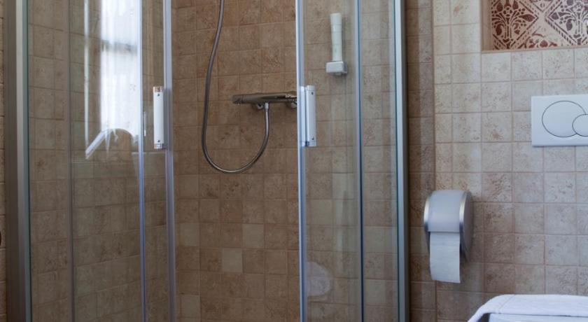 a bathroom with a shower stall and a toilet, Halasi Pince Panzio in Villany