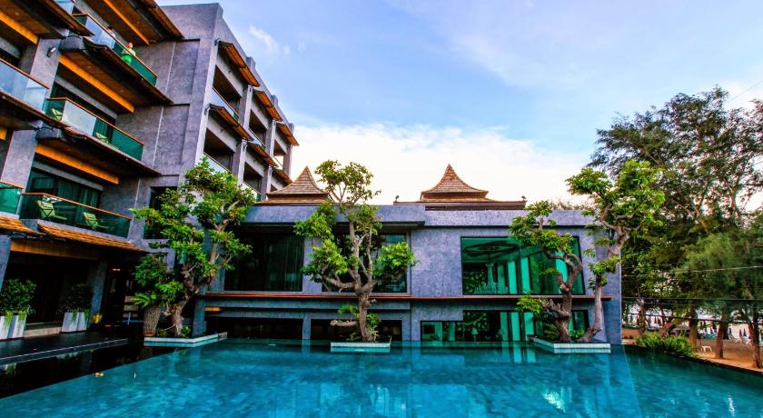 a large swimming pool in a tropical setting, I Calm Resort in Hua Hin / Cha-am