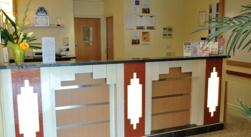 a kitchen area with a counter and a counter top, Carousel Hotel in Blackpool