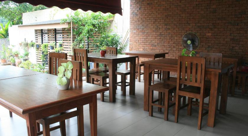 a table with chairs and a table cloth on it, Baan Ing Ping in Chiang Mai