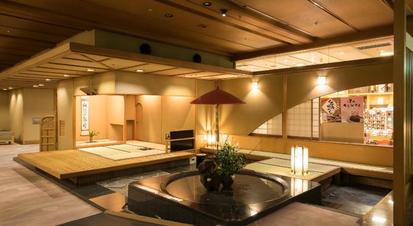 a living room filled with furniture and a large window, Fukuichi in Shibukawa