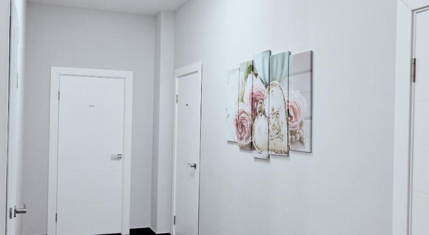a white wall with a picture of a cat on it, Hotel Kapsula in Nur-Sultan