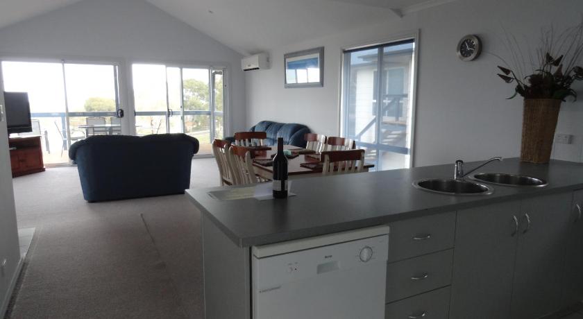 a living room filled with furniture and a window, Kangaroo Island Bayview Villas in Kangaroo Island