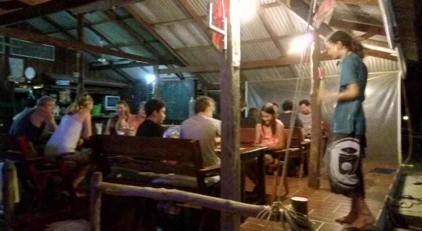 people sitting around a table, Mae Haad Cove Bungalow in Ko Pangan