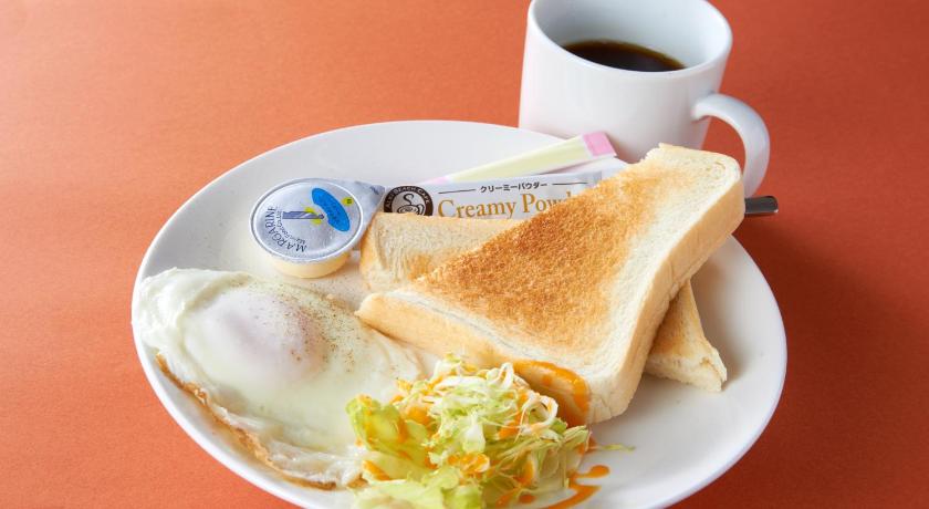 a white plate topped with a sandwich and a cup of coffee, Hotel Carnival (Love Hotel) in Saga