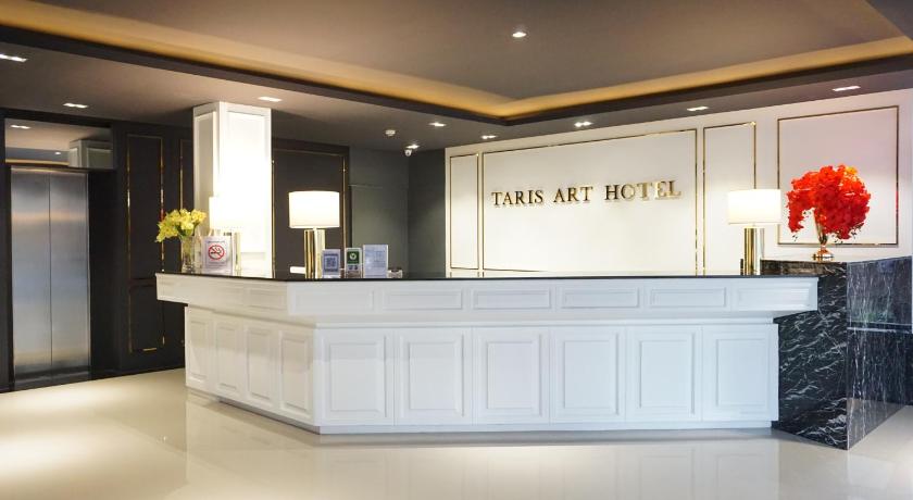 a room with a white counter top and a large mirror, TARIS ART HOTEL PHRAE (SHA Extra Plus) in Phrae