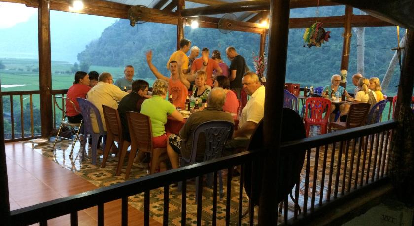 people sitting at tables in a restaurant, Hoang Nguyen Homestay Ba Be in Ba Be