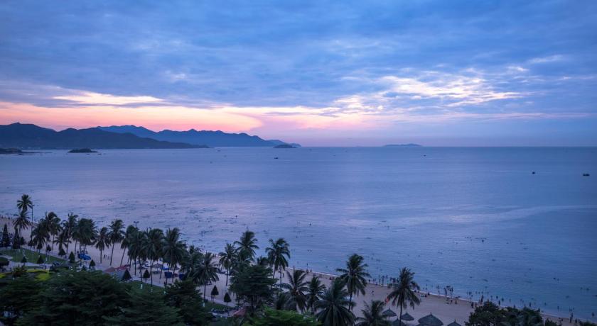 a beach with a view of the ocean, Citadines Bayfront Nha Trang in Nha Trang