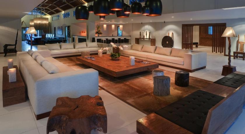 a living room filled with furniture and a fireplace, Luxury Boutique Hotel Bali in Bali