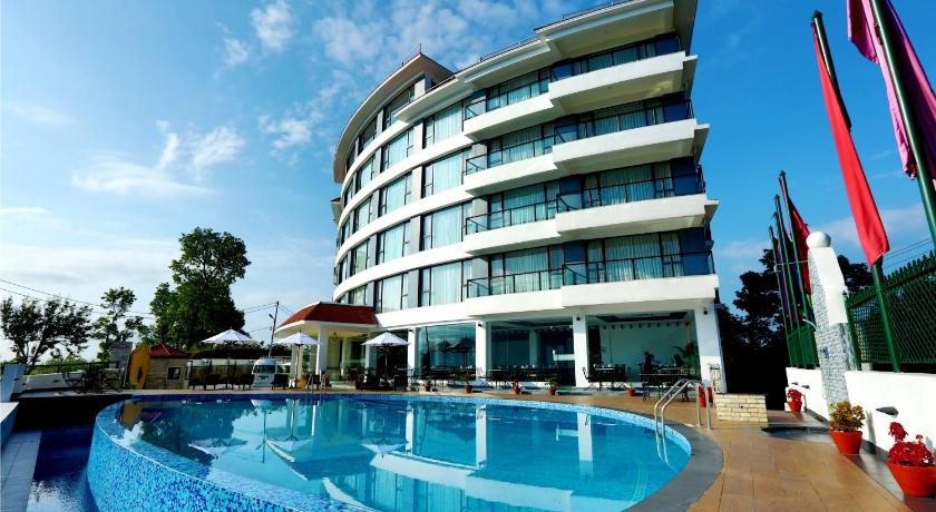 a hotel room with a large swimming pool, Himalayan Front Hotel by KGH Group in Pokhara