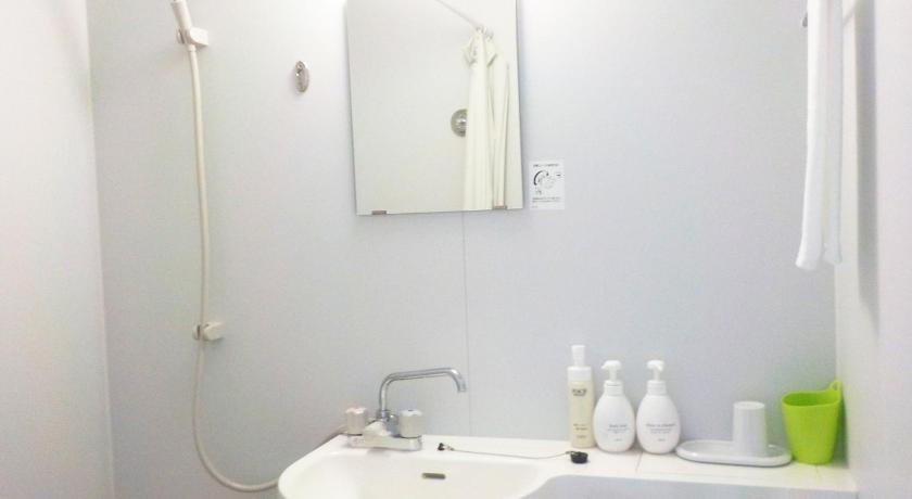 a bathroom with a sink, toilet and shower, Hotel Crown Hills Katsuta Motomachi-ten in Hitachinaka