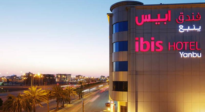 a large building with a sign on the side of it, ibis Yanbu Saudi Arabia Hotel in Yanbu