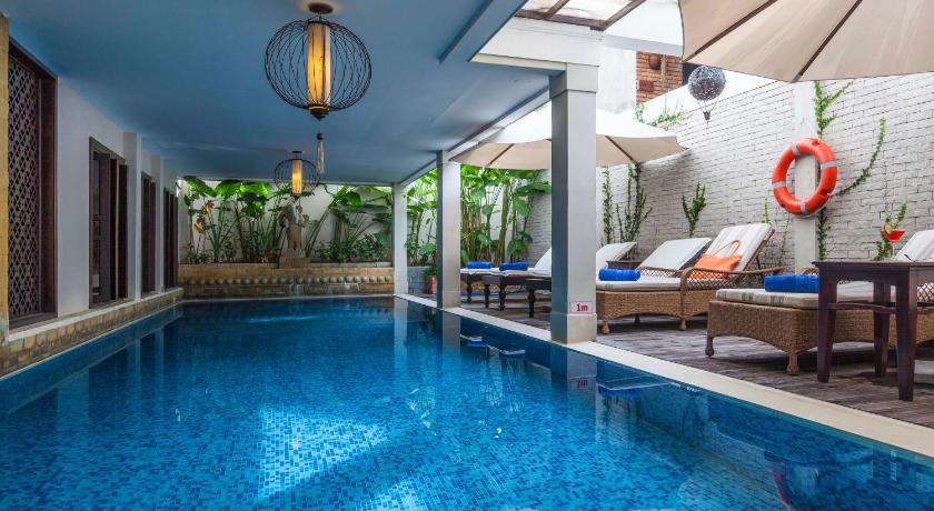 a large swimming pool in a large room, Little Hoi An . A Boutique Hotel & Spa in Hoi An