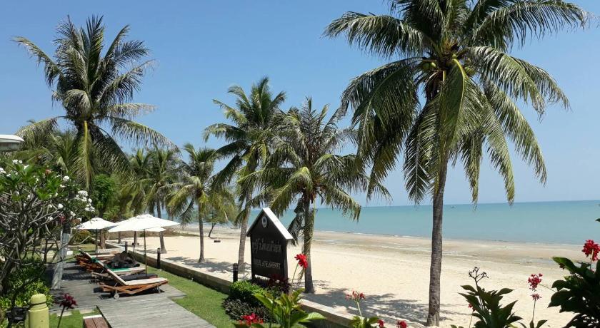 a beach with palm trees and palm trees, Kuiburi Hotel&Resort in Prachuap Khiri Khan