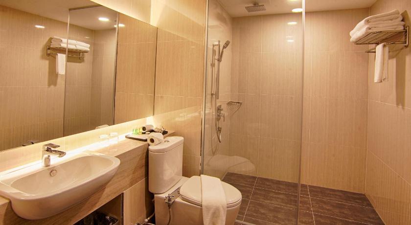 a bathroom with a sink, toilet and shower, Millesime Hotel Johor Bahru in Johor Bahru