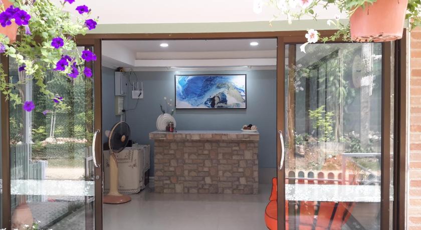 a room with a window and a dog in it, Sky cottage in Ko Samet