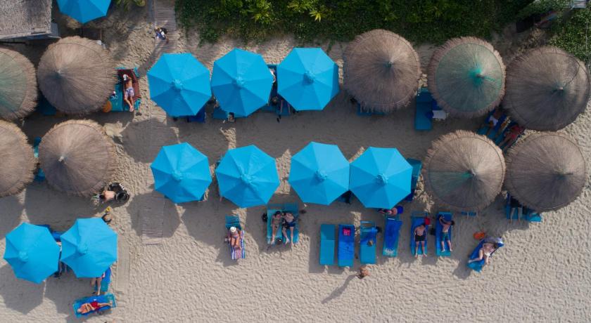 a large group of people with umbrellas on a beach, Dai An Phu Villa in Hoi An