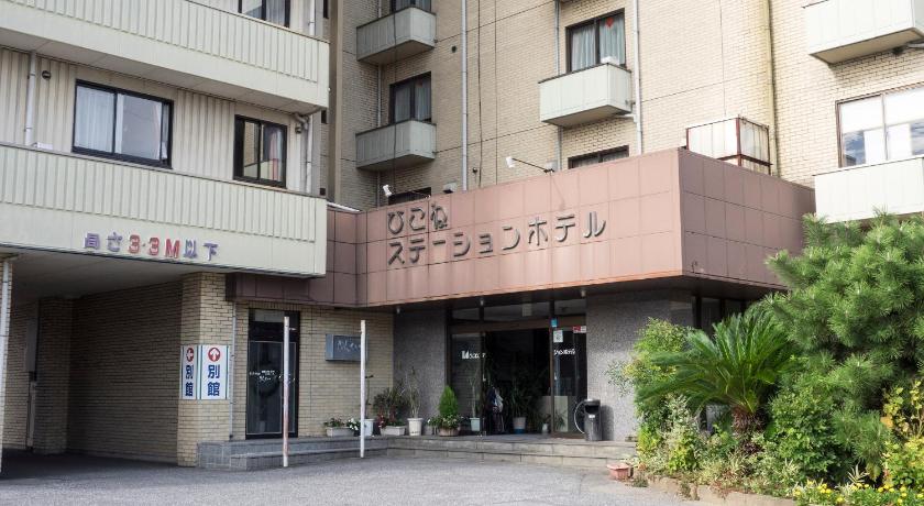 a building with graffiti on the side of it, Hikone Station Hotel in Hikone