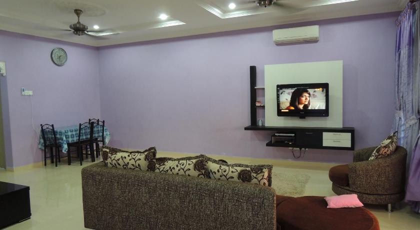 a living room filled with furniture and a tv, Homestay Darulaman in Alor Setar