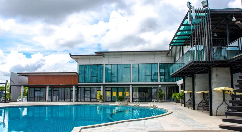 a large swimming pool in front of a large building, Prajaktra Design Hotel (SHA Extra Plus) in Udon Thani