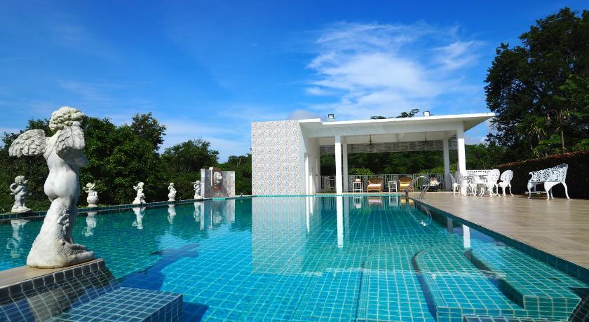 a swimming pool with a pool table and chairs, Baan Ing Khao Resort in Khao Yai