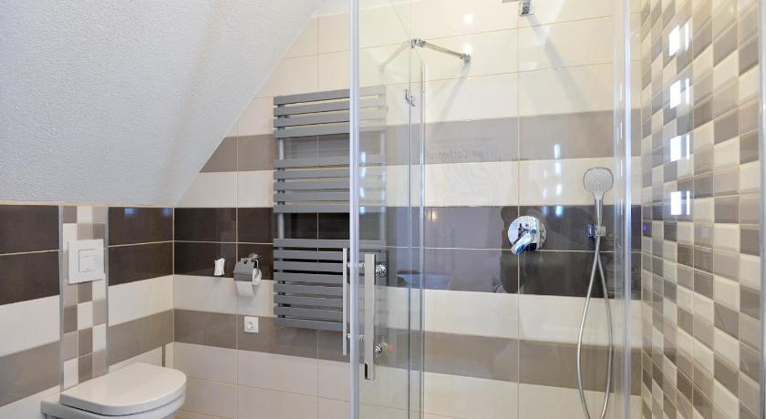 a bathroom with a shower, toilet, and sink, Nobilis Apartman Eger in Eger