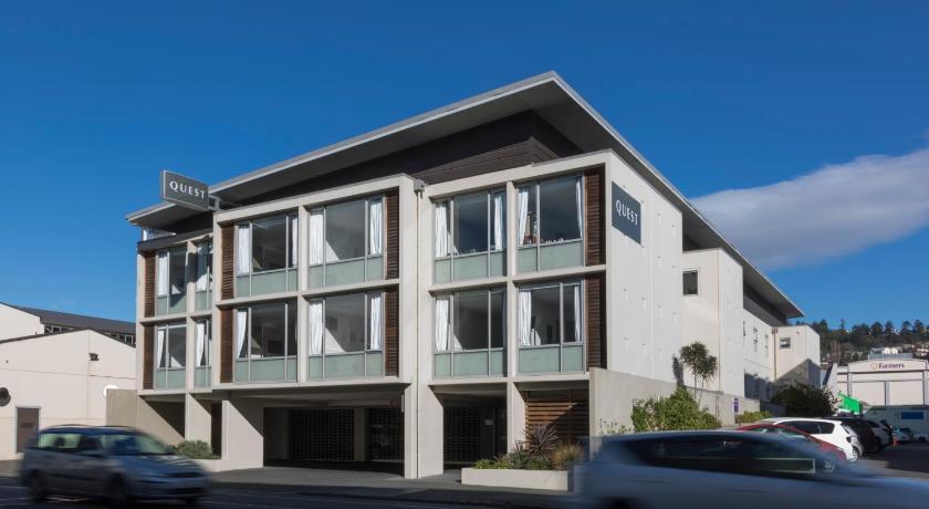 a large white building with a large window, Quest Dunedin Serviced Apartments in Dunedin