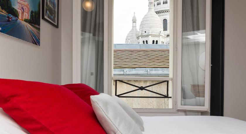 a hotel room with a bed and a window, Ateliers de Montmartre ADM in Paris