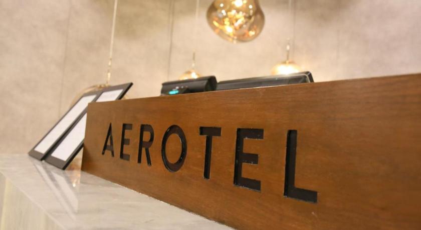a sign that is on top of a wooden table, Aerotel Kuala Lumpur (Airport Hotel) - Gateway@klia2 in Kuala Lumpur