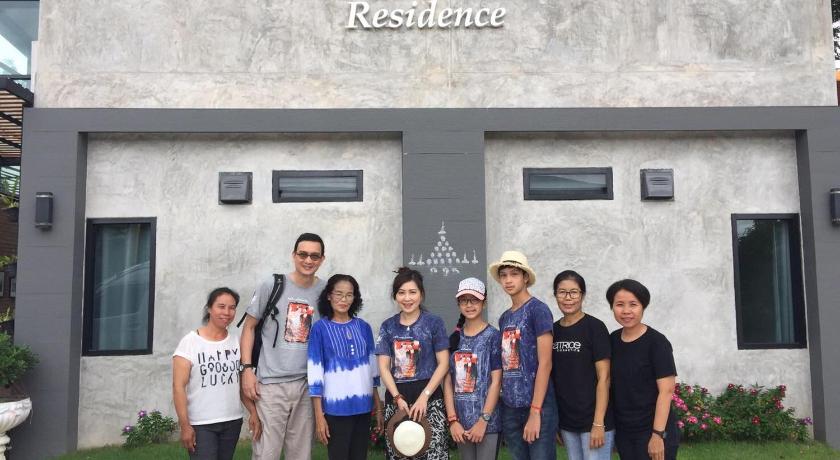 people posing for a picture in front of a building, Pagoda Sight Residence in Nan