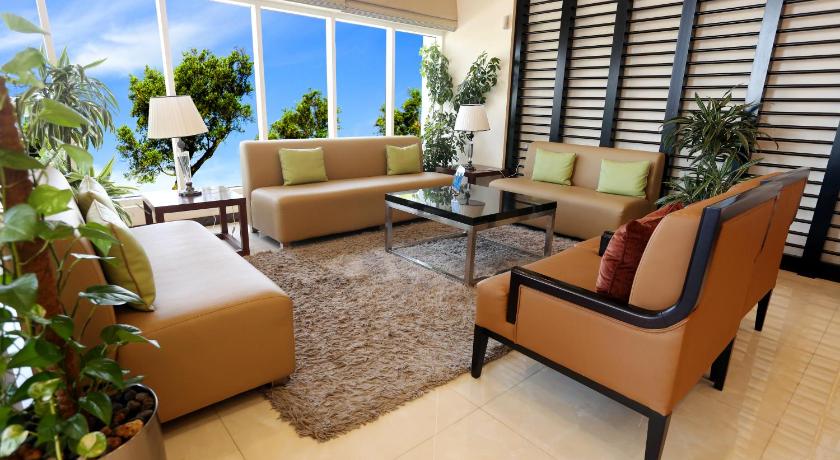 a living room filled with furniture and a window, V Hotel Fujairah in Fujairah