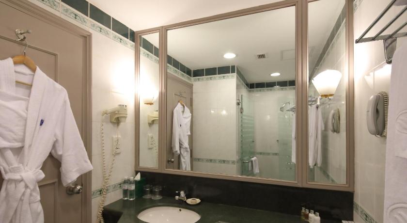 a bathroom with two sinks and a mirror, Sunway Hotel in Hanoi