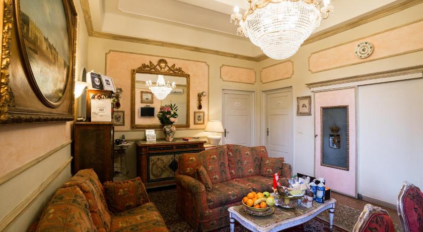 a living room filled with furniture and decor, Antica Residenza D'Azeglio Room&Breakfast di Charme in Bologna
