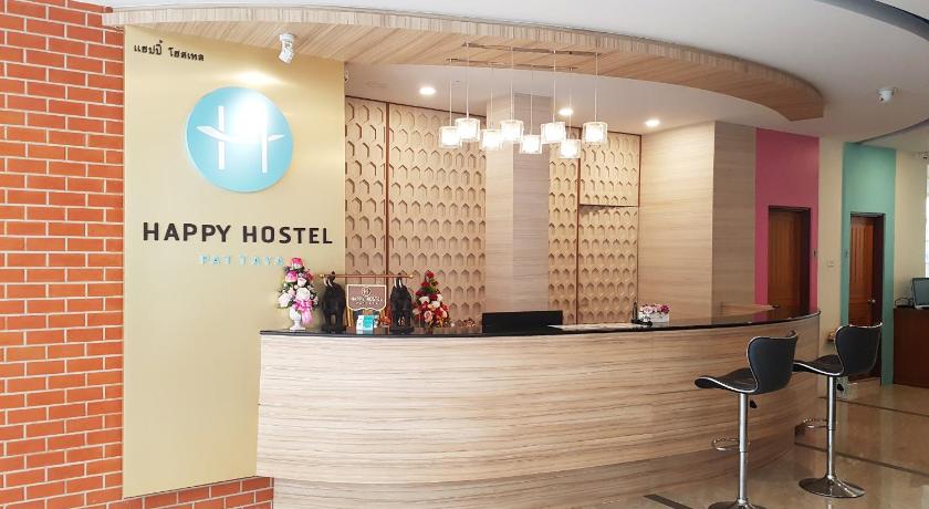 a large room with a large mirror and a table with chairs, Happy Hostel in Pattaya