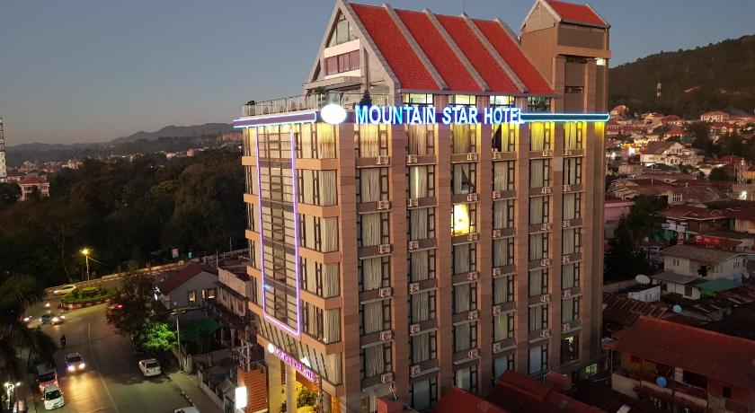 a large building with a clock on top of it, Mountain Star Hotel in Taunggyi