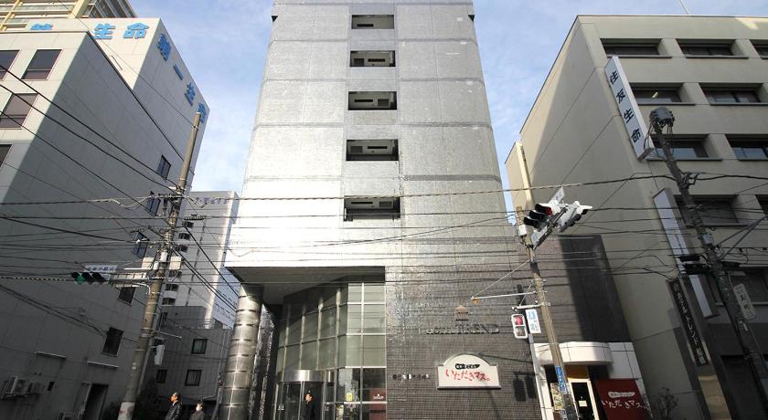 a large building with a clock on the side of it, Hotel Trend Funabashi in Funabashi